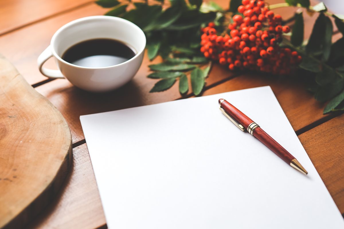 Handwritten story notes beside a keyboard